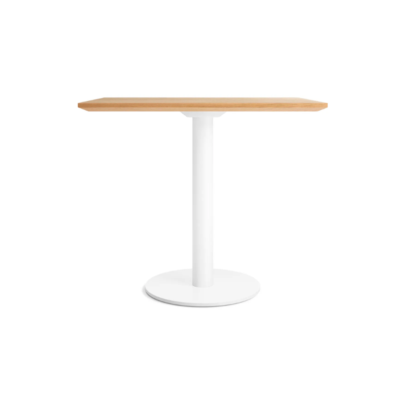 The 32 inch rectangular Easy Dining Table from Blu Dot with a white oak top and white base.