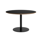 The 48 inch round Easy Dining Table from Blu Dot with a black laminate top and black base from an angle.