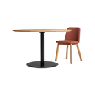 The 48 inch round Easy Dining Table from Blu Dot in a lifestyle.