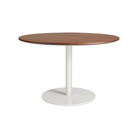 The 48 inch round Easy Dining Table from Blu Dot with a walnut top and white base from an angle.