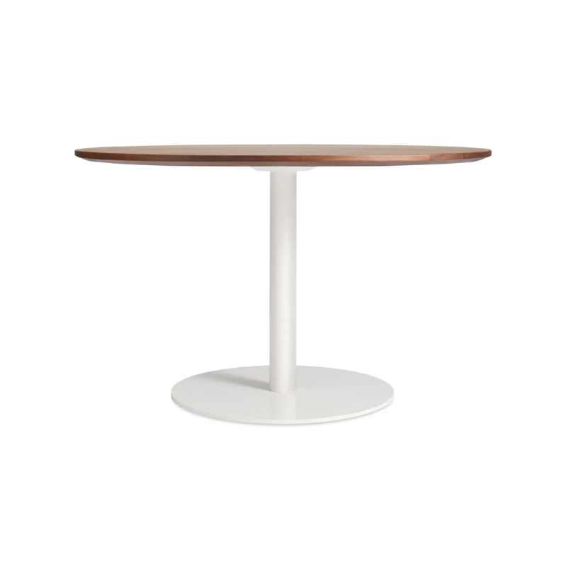 The 48 inch round Easy Dining Table from Blu Dot with a walnut top and white base.