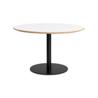 The 48 inch round Easy Dining Table from Blu Dot with a white laminate top and black base from an angle.