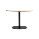 The 48 inch round Easy Dining Table from Blu Dot with a white laminate top and black base.