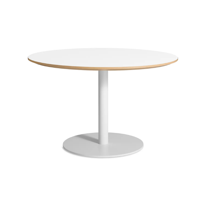 The 48 inch round Easy Dining Table from Blu Dot with a white laminate top and white base from an angle.