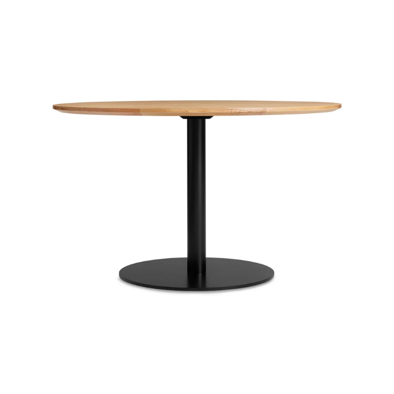 The 48 inch round Easy Dining Table from Blu Dot with a white oak top and black base.