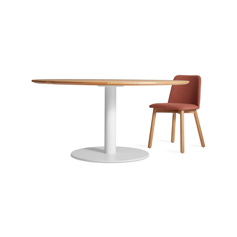 The 60 inch round Easy Dining Table from Blu Dot in a lifestyle.