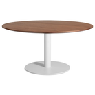 The 60 inch round Easy Dining Table from Blu Dot with a walnut top and white base from an angle.