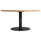 The 60 inch round Easy Dining Table from Blu Dot with a white oak top and black base.