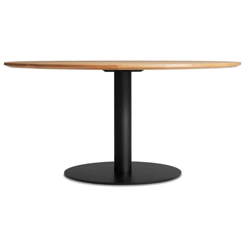 The 60 inch round Easy Dining Table from Blu Dot with a white oak top and black base.