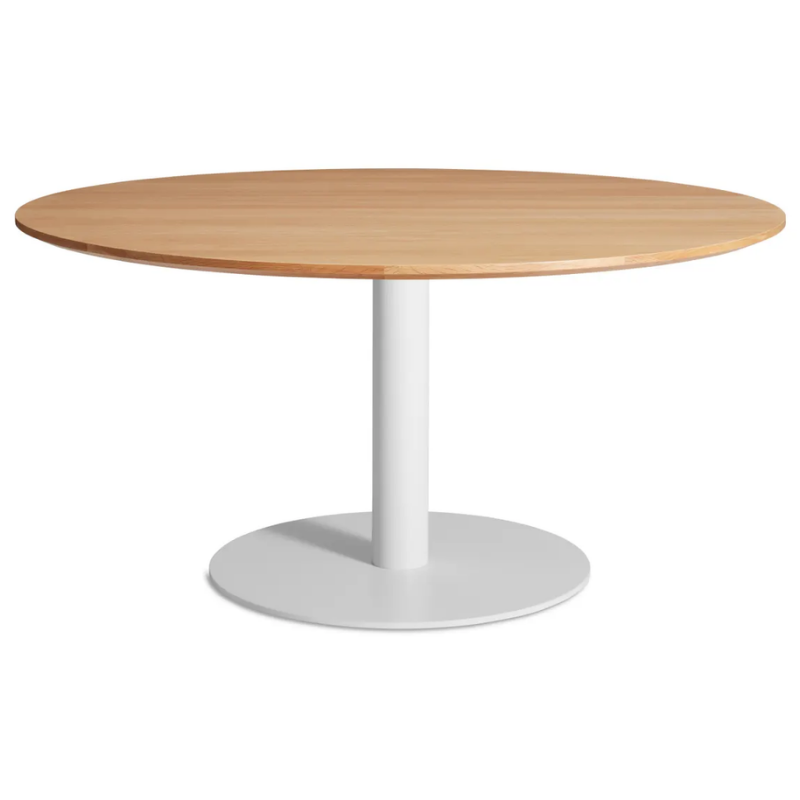 The 60 inch round Easy Dining Table from Blu Dot with a white oak top and white base from an angle.