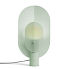 The Filter Table Lamp from Blu Dot in mint turned on.