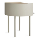 The Li'l Something Side Table from Blu Dot in putty from a back angle.