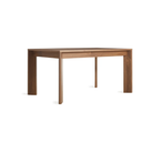 The 60 to 84 inch Moreover Extension Dining Table from Blu Dot in walnut from an angle.