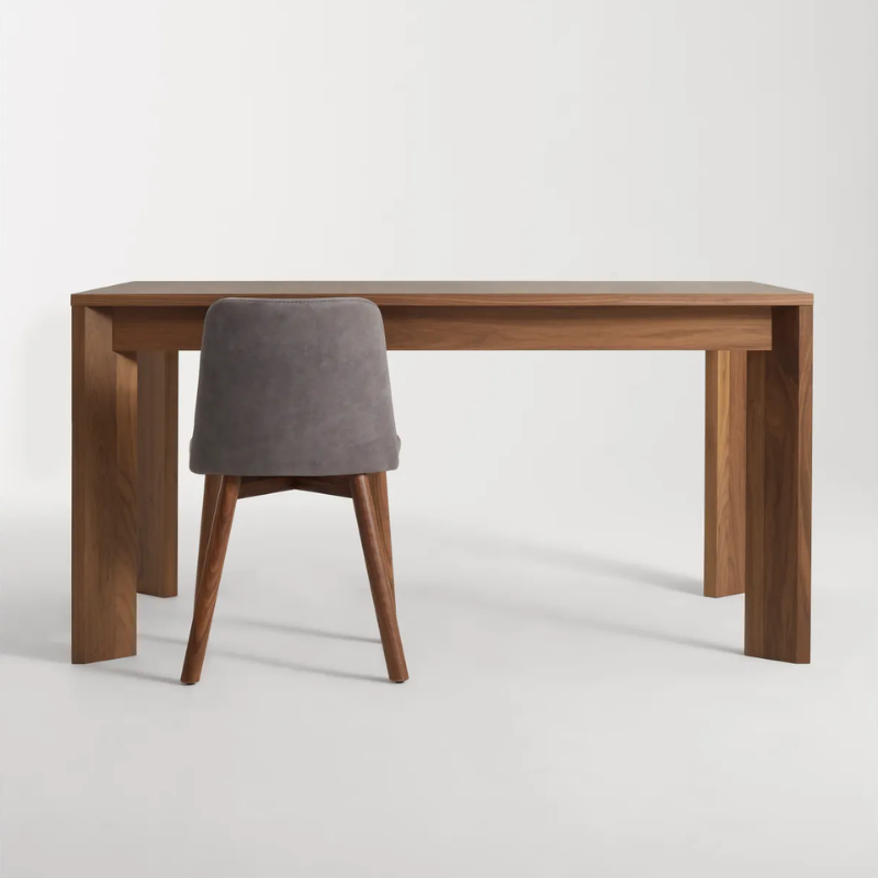 The 60 to 84 inch Moreover Extension Dining Table from Blu Dot in walnut in a lifestyle.