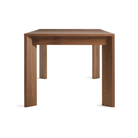 The 60 to 84 inch Moreover Extension Dining Table from Blu Dot in walnut from the side.