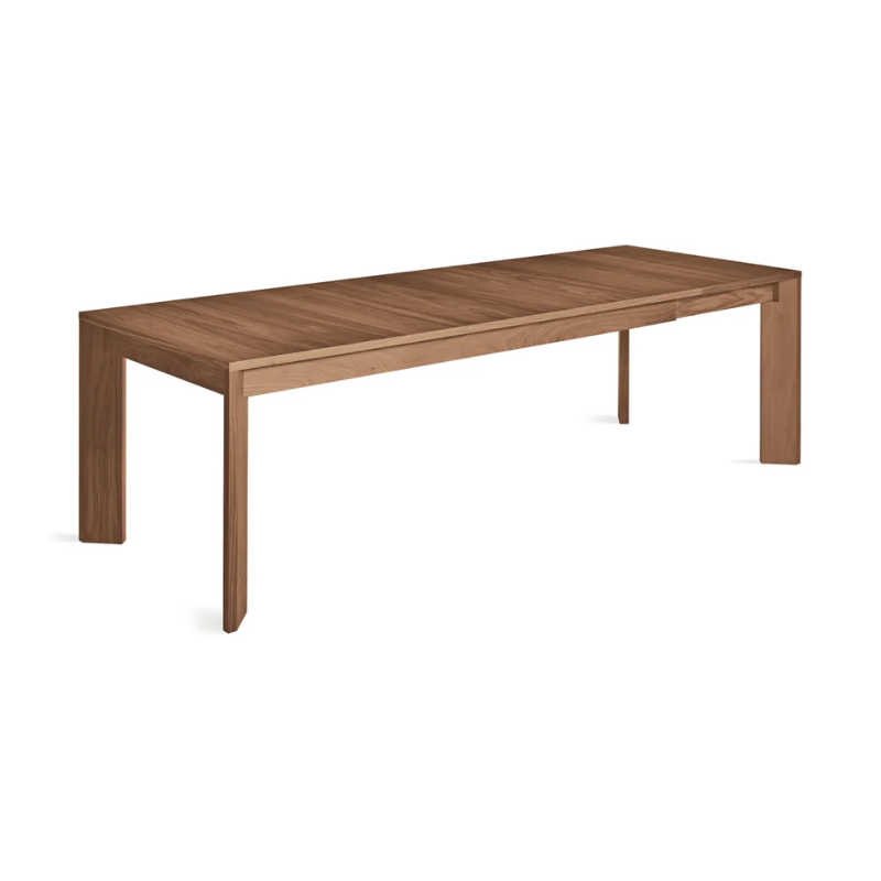 The 80 to 104 inch Moreover Extension Dining Table from Blu Dot in walnut extended from a top angle.