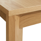 The 60 to 84 inch Moreover Extension Dining Table from Blu Dot in white oak corner.