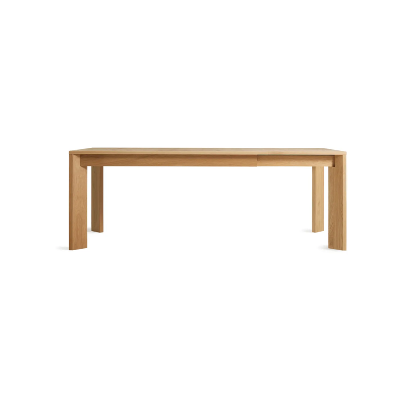 The 60 to 84 inch Moreover Extension Dining Table from Blu Dot in white oak extended.