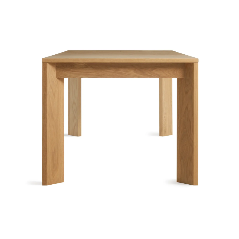 The 60 to 84 inch Moreover Extension Dining Table from Blu Dot in white oak from the side.