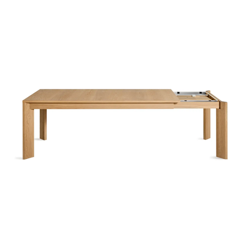 The 80 to 104 inch Moreover Extension Dining Table from Blu Dot in white oak collapsing.