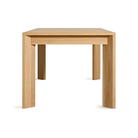 The 80 to 104 inch Moreover Extension Dining Table from Blu Dot in white oak from the side.