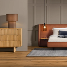 The Murmur 6 Drawer Dresser from Blu Dot in a bedroom.