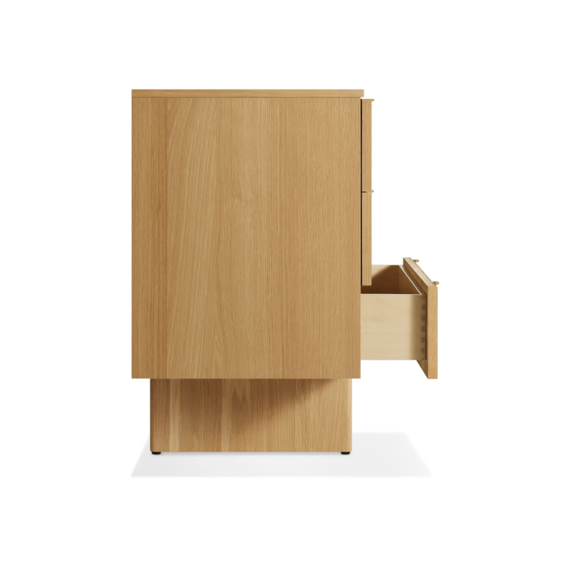 The Murmur 6 Drawer Dresser from Blu Dot in white oak from the side with an open drawer.