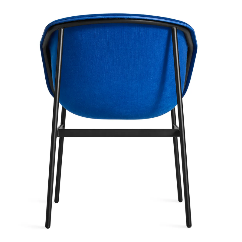 The Past Life Chair from Blu Dot with cobalt seat and black base from the back.