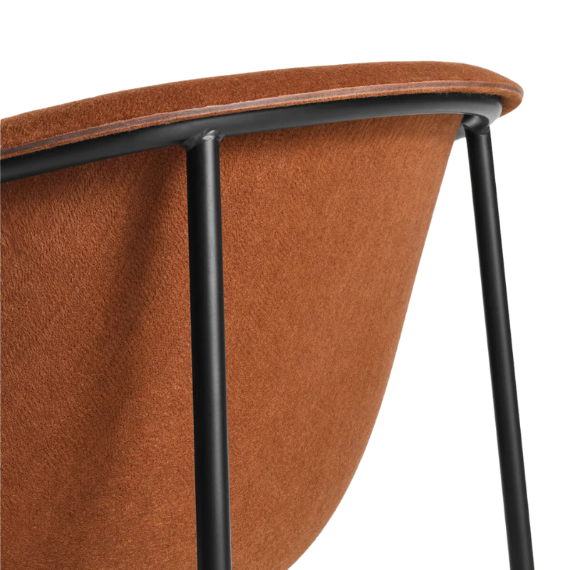 The Past Life Chair from Blu Dot with copper seat and black base in a close up.