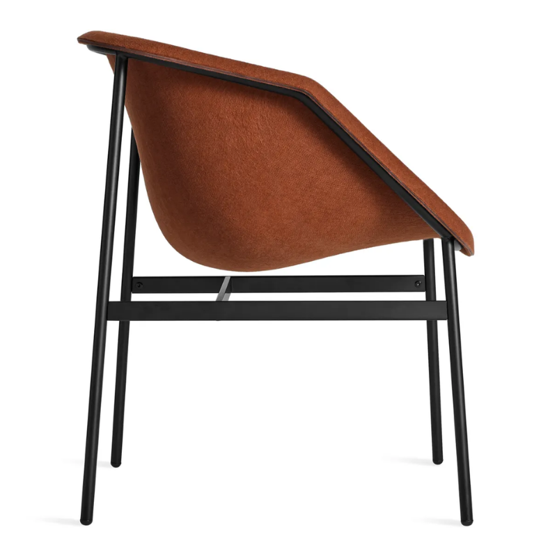 The Past Life Chair from Blu Dot with copper seat and black base from the side.