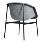 The Past Life Chair from Blu Dot with light grey seat and black base from the back at an angle.