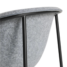 The Past Life Chair from Blu Dot with light grey seat and black base close up.