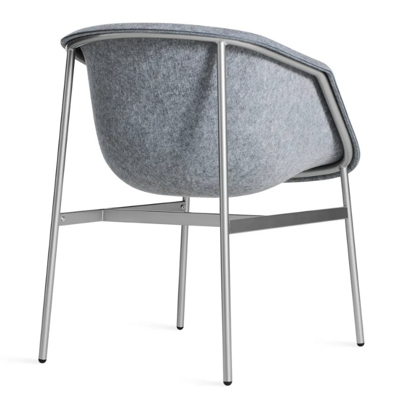 The Past Life Chair from Blu Dot with light grey seat and silver base from the back at an angle.