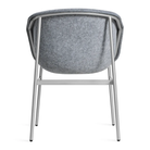 The Past Life Chair from Blu Dot with light grey seat and silver base from the back.