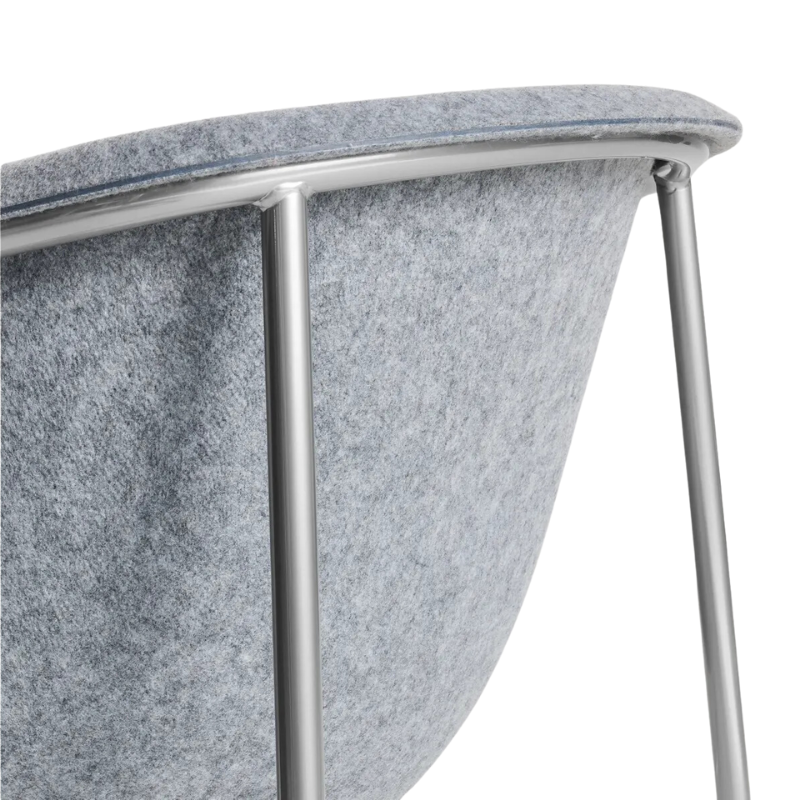 The Past Life Chair from Blu Dot with light grey seat and silver base close up.