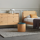 The Peek 6 Drawer Dresser from Blu Dot in a bedroom.