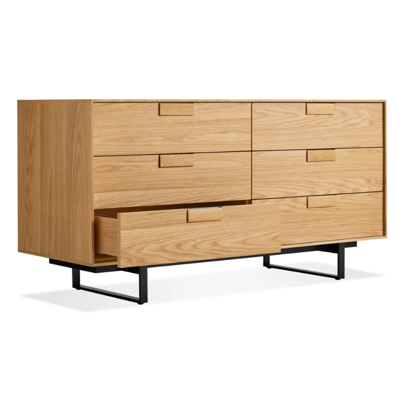 The Series 11 6 Drawer Dresser from Blu Dot in white oak with oblivion legs with an open drawer.