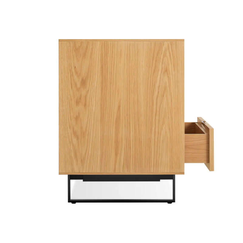 The Series 11 6 Drawer Dresser from Blu Dot in white oak with oblivion legs with an open drawer.