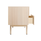 The Shale 4 Drawer Dresser from Blu Dot in hickory from the side with an open drawer.