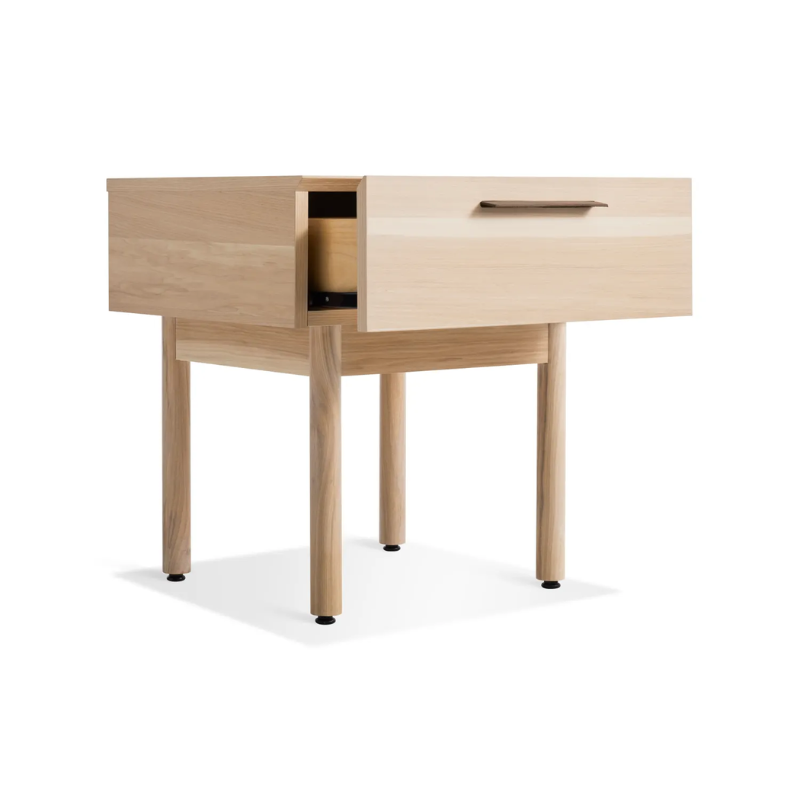 The Shale Nightstand from Blu Dot in hickory from an angle with an open drawer.