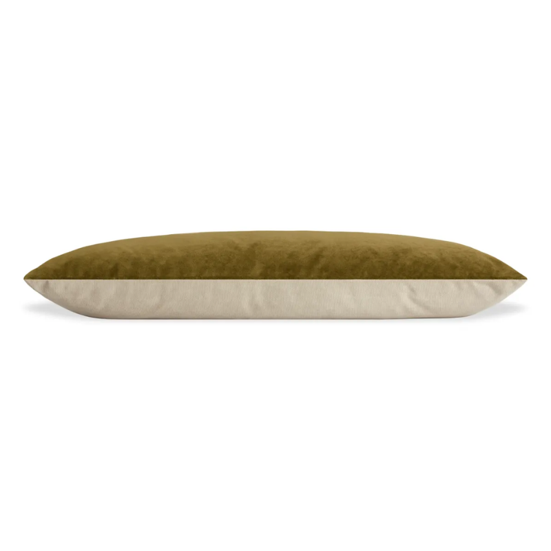 The large Signal Dog Bed from Blu Dot with loden green velvet upholstery from the side.