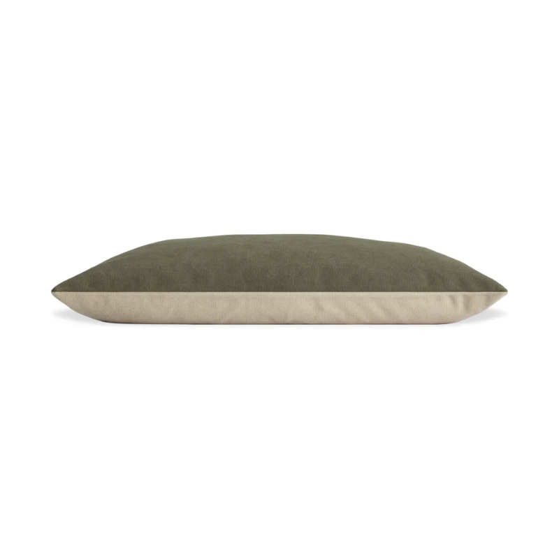 The small Signal Dog Bed from Blu Dot with barto olive upholstery from the side.