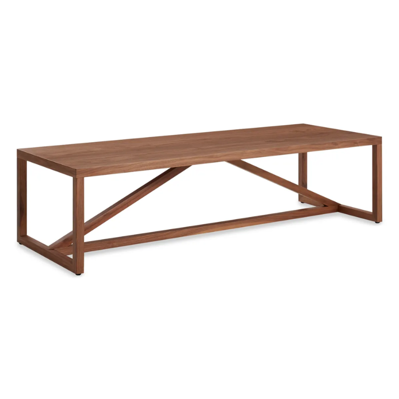 The Strut Wood Coffee Table from Blu Dot in walnut from a top angle.