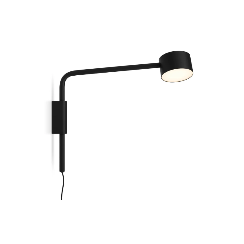 The Verge Adjustable Sconce by Blu Dot in black turned on