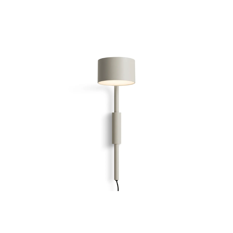 The Verge Adjustable Sconce by Blu Dot in Putty turned on