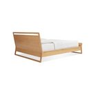 The full-size Woodrow Bed from Blu Dot made with white oak from the back at an angle.