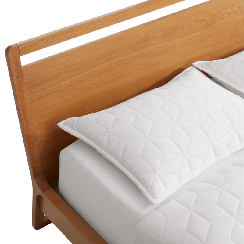 The full-size Woodrow Bed from Blu Dot made with white oak close up.