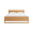 The full-size Woodrow Bed from Blu Dot made with white oak from the foot of the bed.