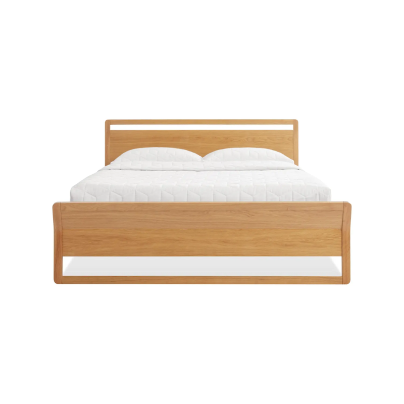 The full-size Woodrow Bed from Blu Dot made with white oak from the foot of the bed.