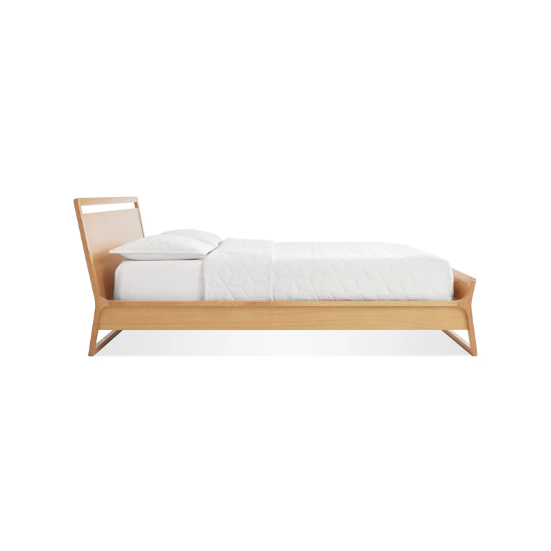 The full-size Woodrow Bed from Blu Dot made with white oak from the side.